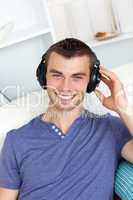 Laughing man listening to music