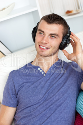 Good-looking man listening to music