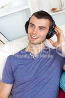 Good-looking man listening to music