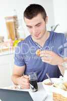 Smiling man having breakfast