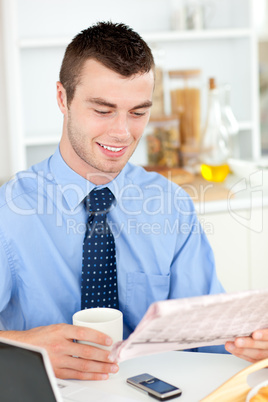 Good-looking man reading a book