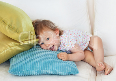 Young girl lying on sofa