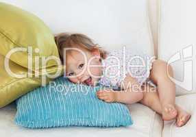 Young girl lying on sofa