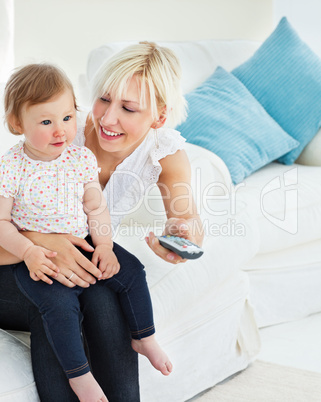 Charming mother playing with her daughter