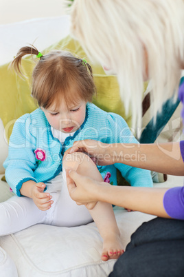 Young sick child lying on couch