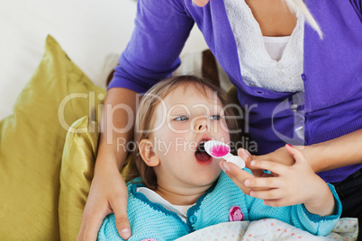 Sick sweet child lying on couch