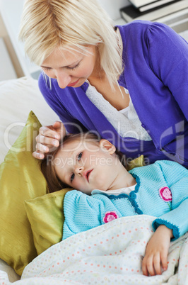 Sick cute child lying on couch