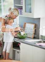 Concentrated mother and child cooking