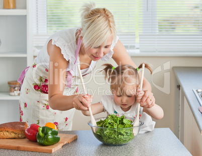 Blond mother and child cooking