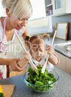 Bright mother and child cooking