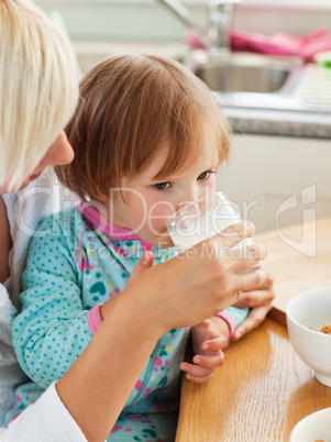 Beauty mother and daughter having breakfast
