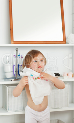 Small girl changing clothes