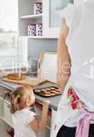 Cute girl standing in kitchen