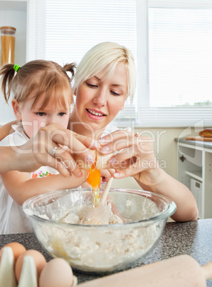 Relaxed mother and child baking cookies