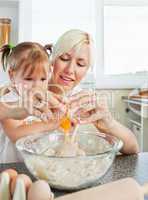 Relaxed mother and child baking cookies
