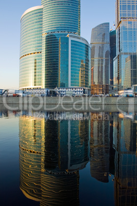 Skyscrapers at sunset and reflection