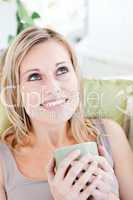 Charming woman holding cup of coffee