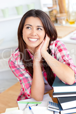 Thinking woman in front of her desk