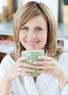 Charming woman drinking something