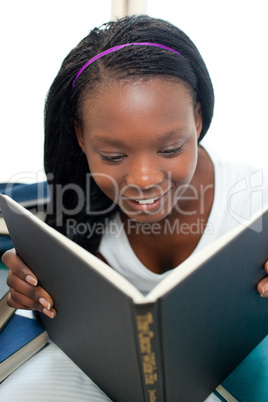 Concentrated woman reading a book