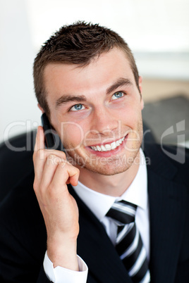 Simper businessman using mobile phone