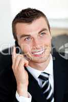 Simper businessman using mobile phone