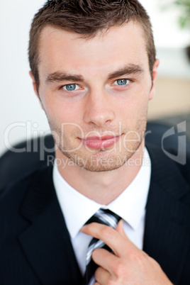 Attractive businessman smiling at camera