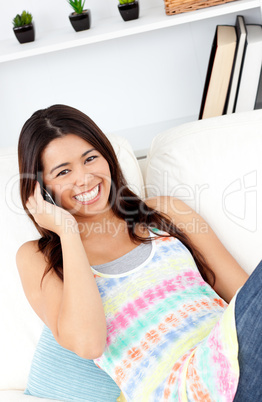 Laughing woman using phone