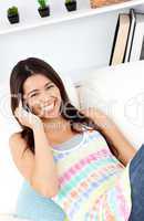 Laughing woman using phone