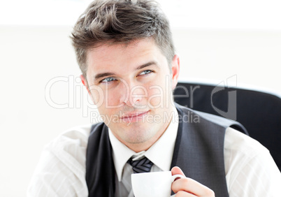 Thinking businessman drinking coffee