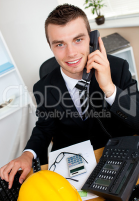 Handsome businessman using phone