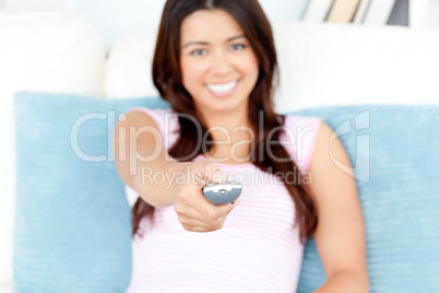 Attractive woman watching TV