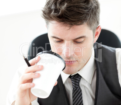 Businessman drinking coffee