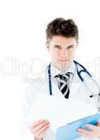 Smiling doctor holding pen