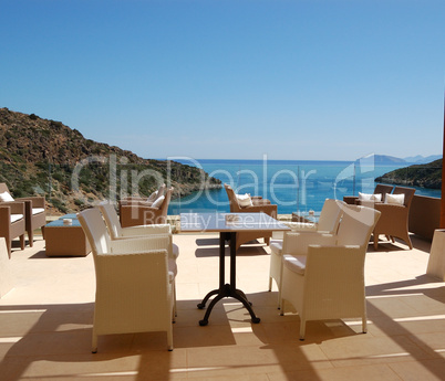 Chairs at sea view relaxation area of luxury hotel, Crete, Greec