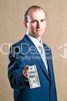 A man in a suit with money