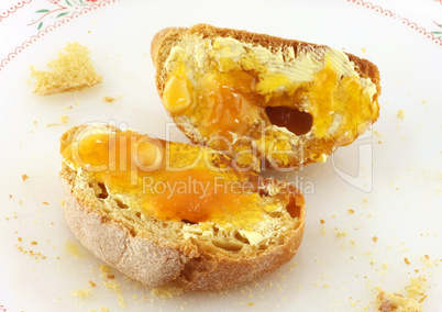 Bread with butter and honey or marmalade