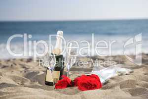 Champagne Bottle, Glasses, Roses at the beach