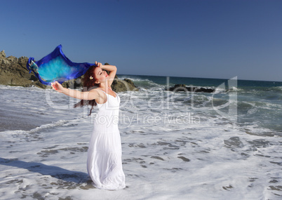 Young Woman at the beach holding