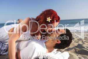 Young couple at the beach about to kiss