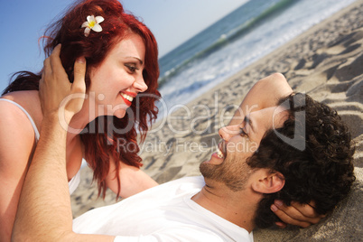 Young couple at the beach about to kiss