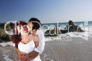 Young Couple at the beach kissing