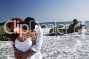 Young Couple at the beach kissing