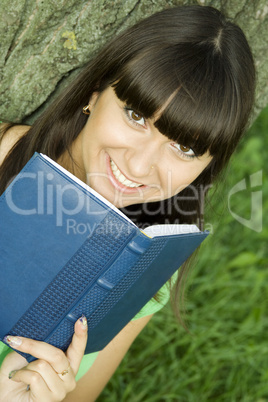 Female in a park with a notebook