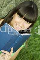 Female in a park with a notebook