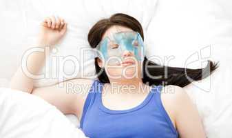Caucasian young woman sleeping with an eye mask