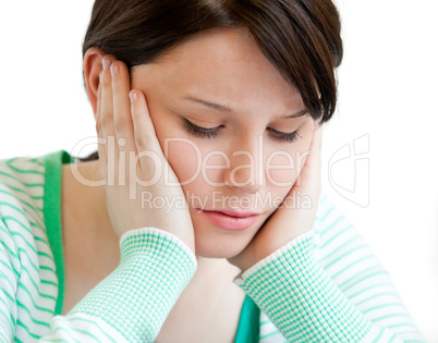 Portrait of a depressed teenager holding up her head on her hand