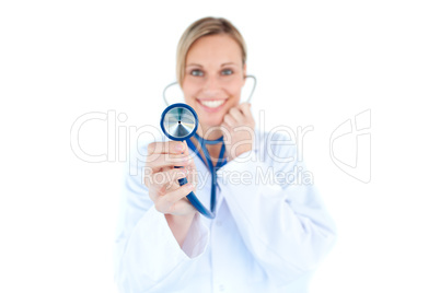 Glowing young doctor holding a stethoscope