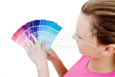 Caucasian woman choosing colours in her living-room