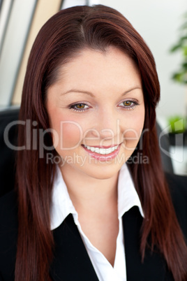 Attractive businesswoman sitting in her office